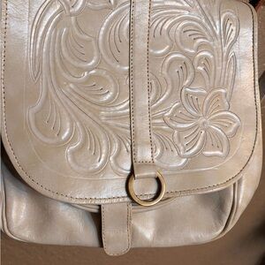 LEADERS IN LEATHER 
One of a kind- 
Embossed Floral Leather purse